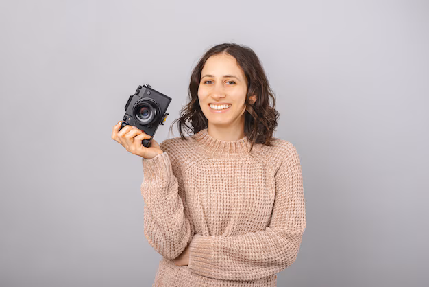 Creator holding camera